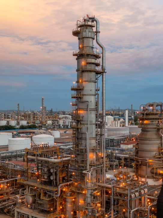 Oil refinery plant from industry zone, Aerial view oil and gas petrochemical industrial, Refinery plant chemical factory oil storage tank and pipeline steel.